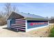 Exterior of the shower house, adorned with a patriotic American flag mural at 3559 N Us Highway 41, Bloomingdale, IN 47832