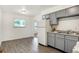 Bright, clean kitchen with gray cabinets and an eat-in dining area at 3809 Wildwood Dr, Indianapolis, IN 46239