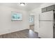 Light-filled kitchen with modern flooring and a view to other rooms at 3809 Wildwood Dr, Indianapolis, IN 46239