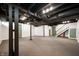 Unfinished basement featuring painted ceiling and access to a staircase at 4102 N Illinois St, Indianapolis, IN 46208