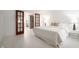 Bright bedroom with white-painted floors, red sliding doors and a modern, minimalist aesthetic at 4102 N Illinois St, Indianapolis, IN 46208
