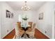 Elegant dining room with a chandelier, hardwood floors, and plenty of natural light at 4102 N Illinois St, Indianapolis, IN 46208