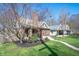 Charming brick home with a well-maintained lawn and inviting front porch at 4102 N Illinois St, Indianapolis, IN 46208