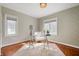 Bright home office with natural light, hardwood floors and a patterned rug at 4102 N Illinois St, Indianapolis, IN 46208