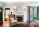 Cozy living room with fireplace and French doors, offering a warm and inviting space at 4102 N Illinois St, Indianapolis, IN 46208