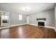 Spacious living room with hardwood floors and a charming fireplace at 4102 N Illinois St, Indianapolis, IN 46208