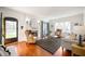 Cozy living room with hardwood floors, fireplace, and ample natural light at 4102 N Illinois St, Indianapolis, IN 46208