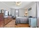 This bedroom has hardwood floors, natural light, and two dressers at 4159 Asbury St, Indianapolis, IN 46227