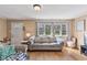 Bright living room with hardwood floors and a comfortable seating area at 4159 Asbury St, Indianapolis, IN 46227