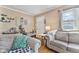 Cozy living room featuring neutral-toned sofas and natural light at 4159 Asbury St, Indianapolis, IN 46227