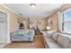 Spacious living room with comfortable sofas and hardwood floors at 4159 Asbury St, Indianapolis, IN 46227