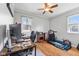 Bright office space with natural light, hardwood floors, and a ceiling fan at 4159 Asbury St, Indianapolis, IN 46227