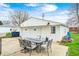 Backyard featuring a charming patio setup with outdoor seating, perfect for relaxing or entertaining at 438 N 11Th Ave, Beech Grove, IN 46107
