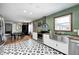 Open concept kitchen with stainless steel appliances, and decorative flooring, connecting to the dining area at 438 N 11Th Ave, Beech Grove, IN 46107