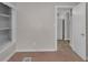 Bedroom featuring built-in shelving and an open doorway at 4618 W Beecher St, Indianapolis, IN 46241
