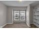 Bedroom with built-in closet and large window at 4618 W Beecher St, Indianapolis, IN 46241