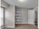 Bedroom featuring carpet and built-in shelves at 4618 W Beecher St, Indianapolis, IN 46241