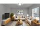 Inviting living room with neutral tones, modern decor, and plenty of natural light at 4618 W Beecher St, Indianapolis, IN 46241