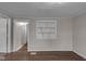 Open space featuring hardwood floors and neutral walls at 4618 W Beecher St, Indianapolis, IN 46241
