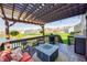 Outdoor deck with a pergola, fire pit table, seating and a grill overlooking the backyard at 4644 Shelby Cir, Greenwood, IN 46143