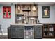 Basement wet bar featuring a sink, beverage cooler, shelving and wood plank accent wall at 4644 Shelby Cir, Greenwood, IN 46143