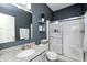 Bathroom with granite countertop vanity and glass shower enclosure at 4644 Shelby Cir, Greenwood, IN 46143