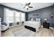 Serene bedroom features a plush bed, natural light from surrounding windows, and comfortable seating at 4644 Shelby Cir, Greenwood, IN 46143