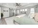 Bright bedroom with natural light, tray ceiling, and sliding barn door to bathroom at 4644 Shelby Cir, Greenwood, IN 46143