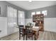 Dining room showcasing wood floors, vintage hutch, and plenty of natural light at 4644 Shelby Cir, Greenwood, IN 46143