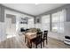Well-lit dining room with view to entryway, neutral color palette and ample natural light at 4644 Shelby Cir, Greenwood, IN 46143