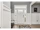 Inviting foyer with wainscoting, stylish light fixtures, and a front door with sidelights at 4644 Shelby Cir, Greenwood, IN 46143