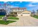 Inviting two-story home with a three car garage, well-kept lawn, and features an attractive front yard landscape at 4644 Shelby Cir, Greenwood, IN 46143