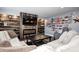 The modern living room boasts a decorative fireplace, wood accents, and comfortable seating at 4644 Shelby Cir, Greenwood, IN 46143