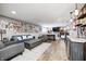 Inviting living room with modern decor, a bar, and a gallery wall at 4644 Shelby Cir, Greenwood, IN 46143