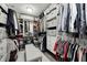 Organized walk-in closet providing ample storage with shelving, hanging rods, and a center bench at 4644 Shelby Cir, Greenwood, IN 46143