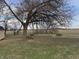 Backyard featuring mature tree, firewood pile and picnic table, perfect for outdoor enjoyment at 4653 E Us Highway 36, Markleville, IN 46056