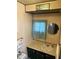Bathroom featuring a sink, mirror, and decorative accents at 4653 E Us Highway 36, Markleville, IN 46056