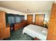 Cozy bedroom featuring carpet, a comfortable bed, and plenty of closet space at 4653 E Us Highway 36, Markleville, IN 46056