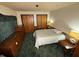 Cozy bedroom featuring carpet, a comfortable bed, and plenty of closet space at 4653 E Us Highway 36, Markleville, IN 46056