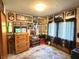 Bedroom displaying unique decor with framed pictures, dresser, and window with curtains at 4653 E Us Highway 36, Markleville, IN 46056