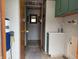 Hallway to the Bathroom, with green trim and water heater at 4653 E Us Highway 36, Markleville, IN 46056