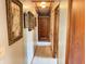 View of the hallway with decorated walls and a door at the end of the hall at 4653 E Us Highway 36, Markleville, IN 46056