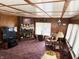 Comfortable living room with brick fireplace, offering a warm and inviting atmosphere at 4653 E Us Highway 36, Markleville, IN 46056