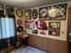 View of a living room displaying many framed beer and alcohol signs hanging on the wall at 4653 E Us Highway 36, Markleville, IN 46056