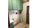 Utility area with green cabinets, exposed utilities and vent at 4653 E Us Highway 36, Markleville, IN 46056