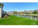 Expansive backyard featuring a tranquil pond, lush greenery, and a private deck at 4858 Brentridge Pl, Greenwood, IN 46143