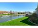 Scenic view of the property's pond, complete with a fountain and lush landscaping at 4858 Brentridge Pl, Greenwood, IN 46143