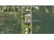 An aerial view of a large property with a pool surrounded by green fields at 4902 N 700 W McCordsville, IN 46055 at 4902 N 700 W, McCordsville, IN 46055