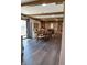 This dining room with exposed wood beams flows into a living room and kitchen at 4902 N 700 W, McCordsville, IN 46055