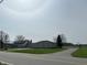 Charming exterior featuring stone accents and a large yard in a serene, country setting at 4902 N 700 W, McCordsville, IN 46055